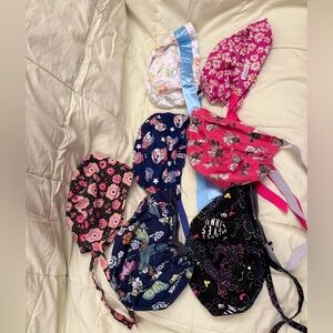 A lot of surgical scrub hats.